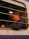 Ashe inside our evening train. Its excruciatingly slow place and long stops at ghost town-ish stations made the train more our jail for the night than a mode of transport.